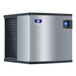 A silver and black Manitowoc air cooled ice machine with blue and black trim.