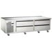 A large stainless steel Traulsen 4 drawer freezer chef base.