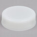 A white Tablecraft plastic end cap on a gray surface.