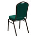 A Flash Furniture green fabric banquet chair with gold vein frame.