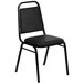 A black Flash Furniture banquet chair with black leather seat and metal frame.