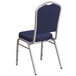 A navy blue Flash Furniture banquet chair with a silver frame and back.