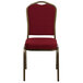 A burgundy Flash Furniture banquet chair with gold frame.
