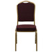 A Flash Furniture burgundy banquet chair with a gold frame.