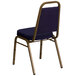 A blue and navy blue banquet chair with a gold frame.