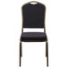 A Flash Furniture black pattern fabric banquet chair with a gold vein frame.