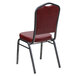 A Flash Furniture Hercules burgundy vinyl banquet chair with silver vein metal frame.