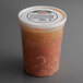 A Spring Glen Fresh Foods plastic container of Macaroni and Beef in Sauce with a white lid.