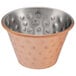 A Choice hammered copper and stainless steel round sauce cup with holes in it.