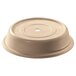 A beige plastic lid with a hole.