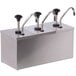 A Carlisle stainless steel pump condiment dispenser with three faucets.