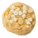 A preformed David's Cookies vanilla chip cookie with white chocolate chips.