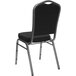 A Flash Furniture black banquet chair with silver vein frame and a black and grey dotted fabric crown back.
