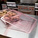 A red Cambro flat lid on a plastic food storage box with potatoes inside.