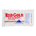 A Red Gold ketchup packet with red and blue text.
