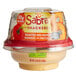 A plastic container of Sabra Roasted Red Pepper Hummus with pretzels inside.
