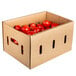 A cardboard box filled with plum tomatoes.