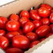 A box of plum tomatoes.