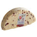 A large white Long Clawson Dairy 1/2 wheel of White Stilton cheese with cranberries.