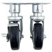 A pair of Vulcan casters with black rubber wheels and metal frames.