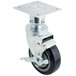 A set of four black metal swivel casters with metal wheels.