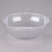 A clear bowl with a white rim on a white surface.