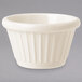 A ivory fluted ramekin with a ribbed pattern.