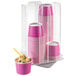 A clear acrylic Cal-Mil revolving cereal cup organizer with four pink and white paper cups filled with ice cream.