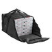 A black ServIt insulated delivery bag holding white pizza boxes.