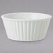 A white bowl with ribbed edges.