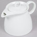 An Arcoroc white ceramic teapot with a lid and handle.