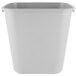 A gray Rubbermaid rectangular wastebasket with a lid.