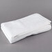 A folded white Oxford Platinum bath towel with a dobby twill border.