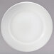 An 8" round white porcelain plate with a white rim.