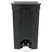 A Lavex black rectangular step-on trash can with a lid.