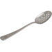 A close-up of a Mercer Culinary stainless steel spoon with holes on it.