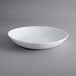An American Metalcraft Crave melamine serving bowl in white on a gray surface.