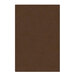 A brown rectangular object with a white border.