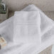 A stack of Oxford Vicenza Bianco white wash cloths on a counter.