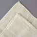 An Oxford Vicenza Avorio hand towel with a folded edge.