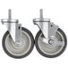 A pair of Beverage-Air stem casters with rubber wheels.