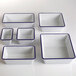 A group of rectangular white and blue speckled melamine serving bowls.