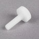 A close-up of a white plastic True Nylon Thumbscrew.