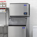 A Manitowoc stainless steel water cooled ice machine with a digital display.