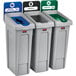 A white Rubbermaid Slim Jim recycling station with green, blue, and red lids.