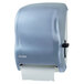 A San Jamar Arctic Blue paper towel dispenser with a white roll of paper towels.
