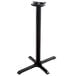 A Lancaster Table & Seating black cast iron bar height table base with a tripod.