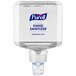 A Purell hand sanitizer dispenser with a white lid.