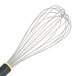 A Matfer Bourgeat stainless steel wire whisk with a yellow Exoglass handle.