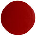 A red round disc with a textured finish.